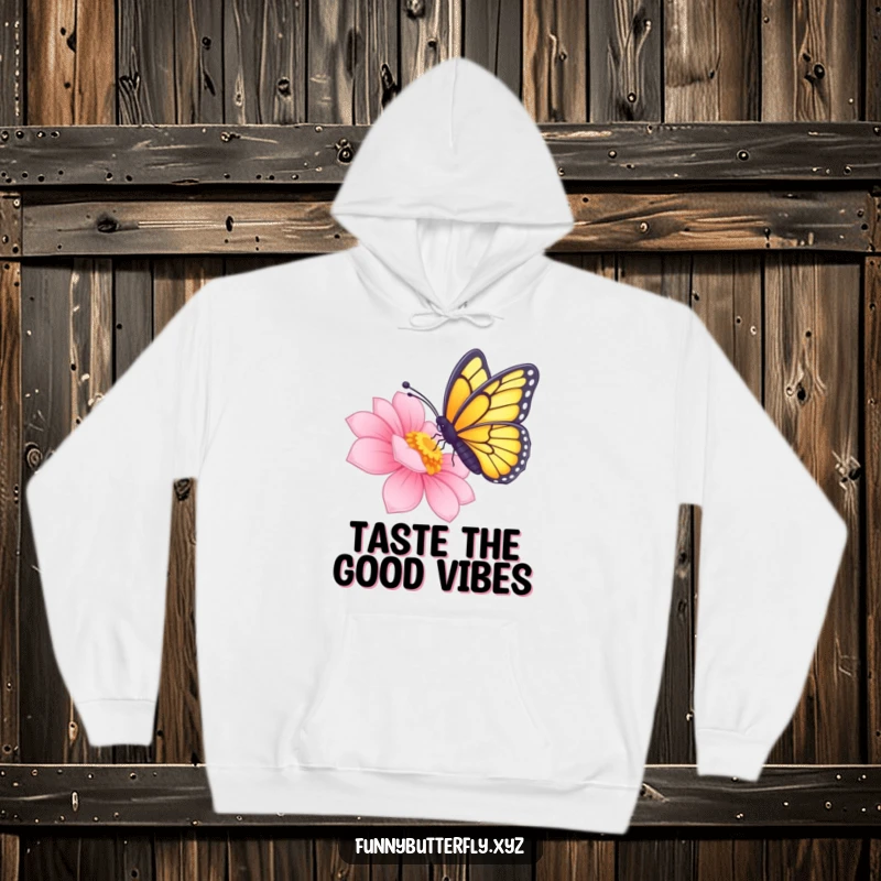 Cozy hoodie adorned with a funny butterfly delicately sipping nectar from a radiant flower using its proboscis.