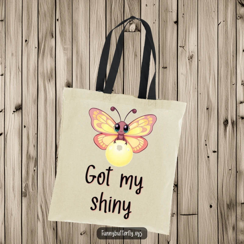 Funny tote bag depicting a curious butterfly with wide eyes fluttering around a brightly glowing orb, a whimsical and practical accessory.